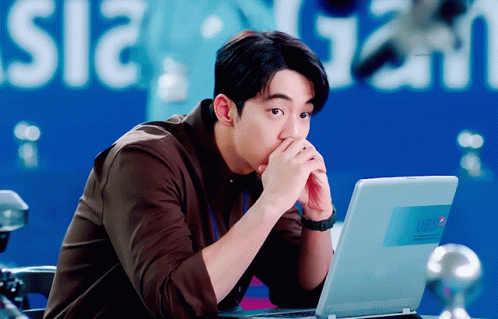 Man Sitting At Laptop With Pepsi Logo