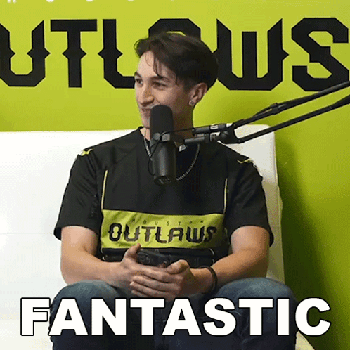 Man Sitting at Microphone With Fantastic
