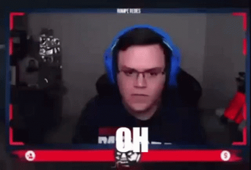 Man Sitting At Screen With Headphones And Glasses GIF