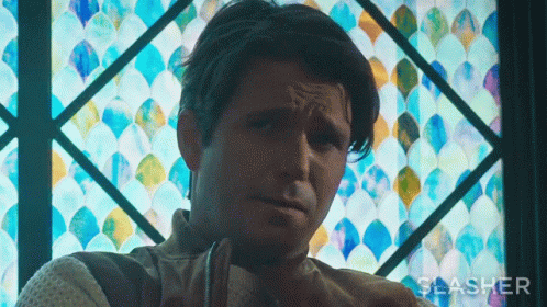Man Sitting at Stained Glass Window Slasher