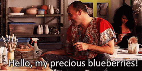 Man Sitting at Table Hello My Precious Blueberries