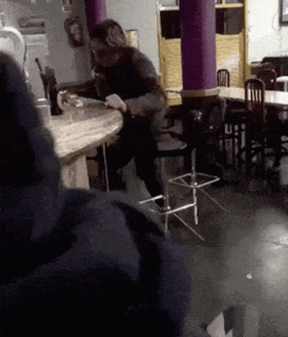 Man Sitting At Table In Restaurant GIF