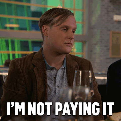 Man Sitting at Table Saying I'm Not Paying