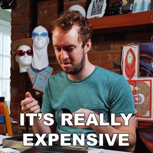 Man Sitting at Table Saying It's Really Expensive