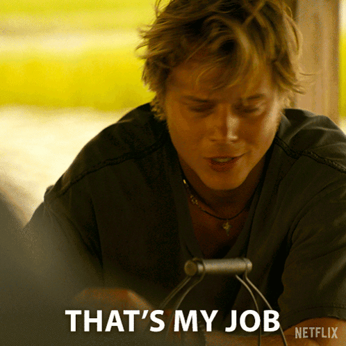 Man Sitting at Table Saying Thats My Job