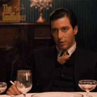 Man Sitting at Table Saying The Godfather
