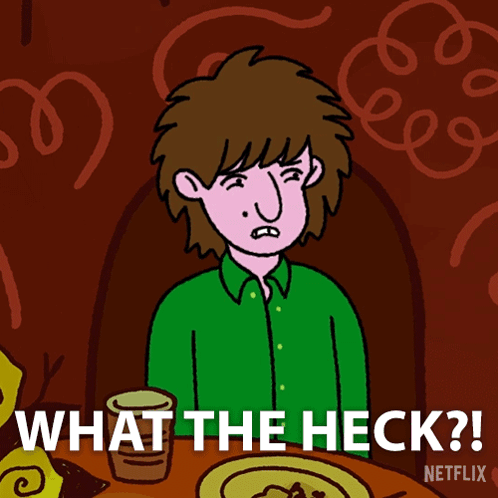 Man Sitting at Table Saying What The Heck