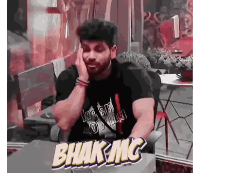 Man Sitting at Table with Bhak Mc Sticker