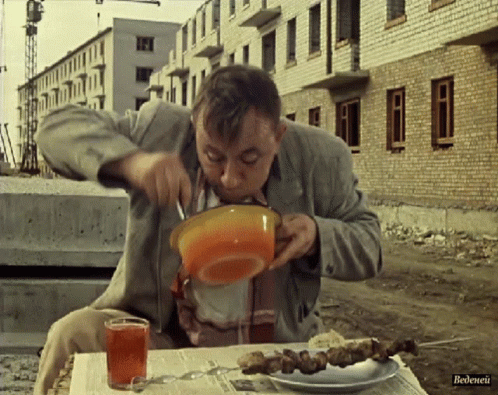 Man Sitting At Table With Food And Tea Bedenei GIF