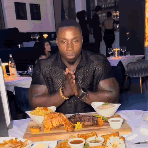 Man Sitting at Table with Food