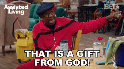 Man Sitting at Table With Gift From God