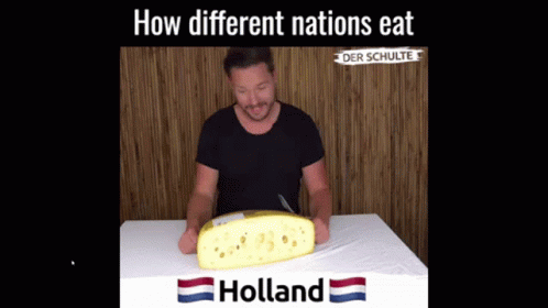 Man Sitting at Table With Holland Cheese