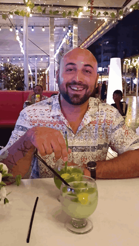 Man Sitting At Table With I Love Drink GIF