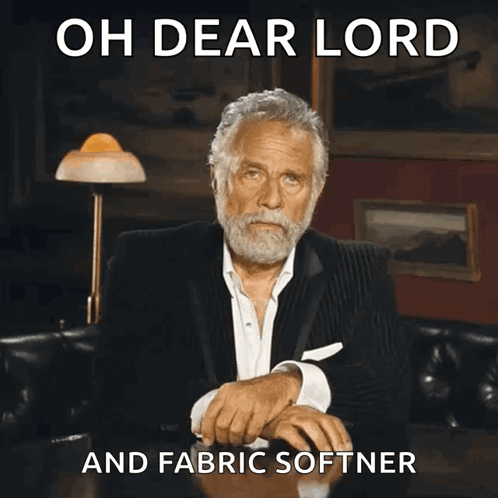 Man Sitting at Table with Oh Dear Lord and Fabric Softener