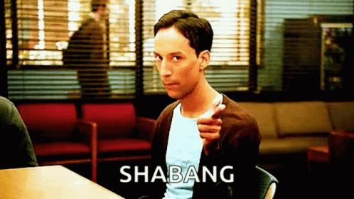Man Sitting at Table With Shabang