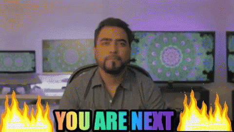 Man Sitting Before Screen Saying You Are Next