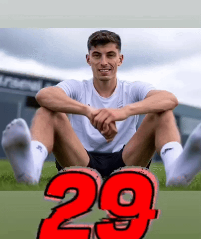 Man Sitting Cross-Legged with Number 29