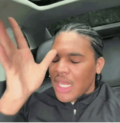 Man Sitting in Back Seat of Car Making Funny Face