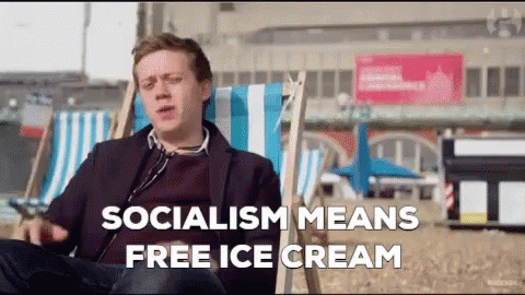 Man Sitting in Beach Chair Saying Socialism Means Free Ice Cream