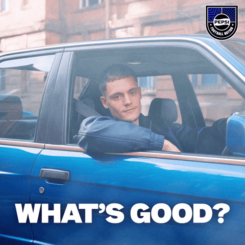 Man Sitting in Blue Car Saying What's Good
