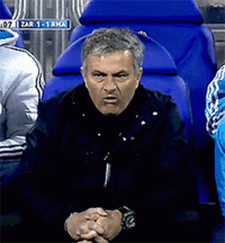 Man Sitting in Blue Chair With Zar Sign