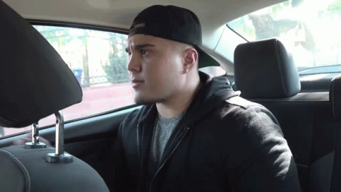 Man Sitting in Car Back Seat