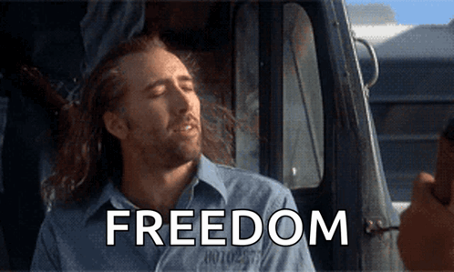 Man Sitting in Car with Freedom Shirt