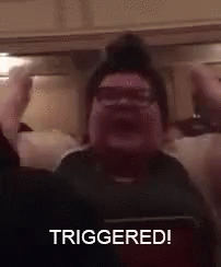 Man Sitting In Chair Hands Up Triggered GIF
