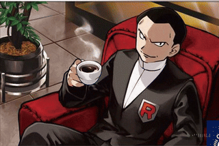 Man Sitting in Chair Holding Coffee