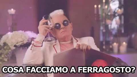 Man Sitting In Chair Holding Wine Cosa Facciamo A Ferragosto GIF