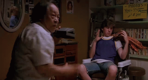Man Sitting in Chair Next to Woman Saying You're Welcome