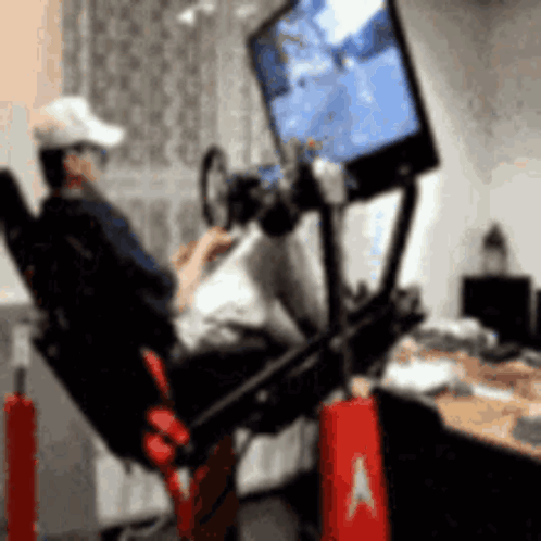 Man Sitting in Chair Playing Video Game