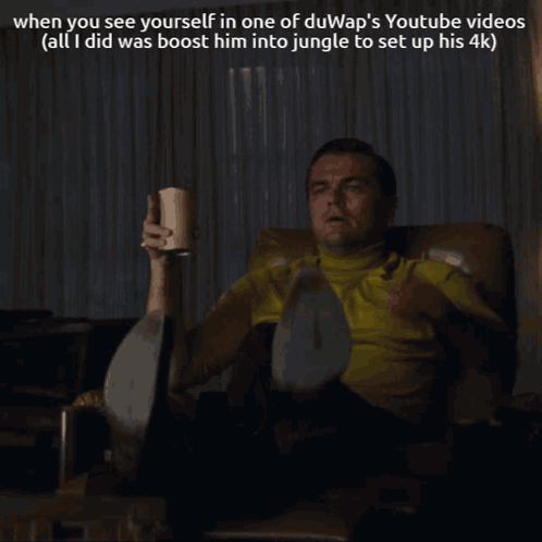 Man Sitting in Chair Pointing at Something