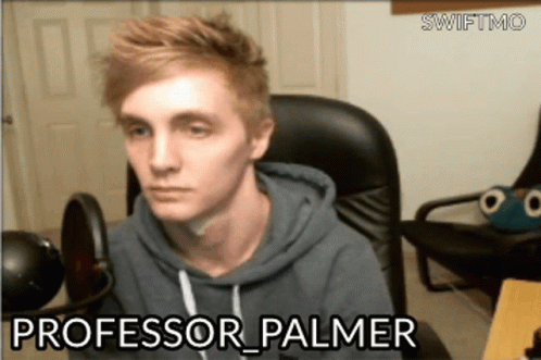 Man Sitting in Chair Professor Palmer