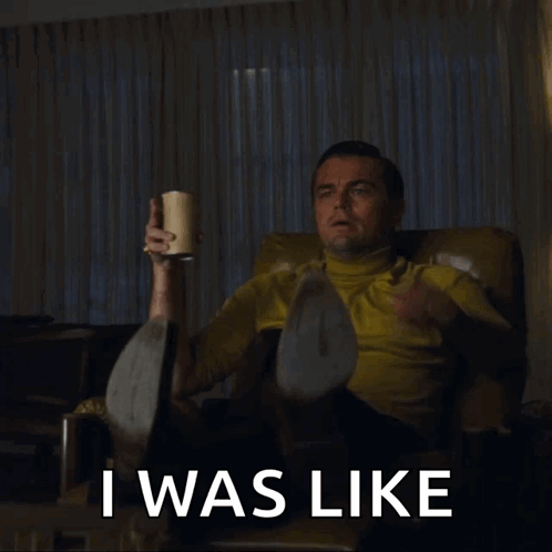 Man Sitting in Chair With Cup Saying I Was Like