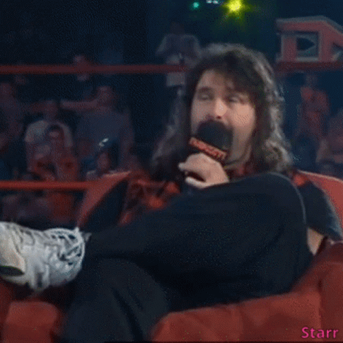 Man Sitting in Chair With Microphone Saying Starr