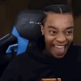 Man Sitting In Chair With Tongue Out GIF