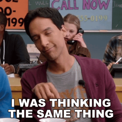 Man Sitting In Classroom With Call Now Sign GIF
