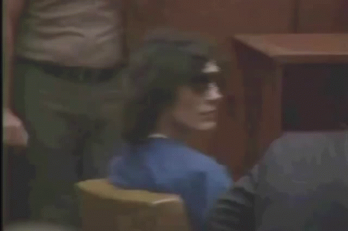 Man Sitting In Courtroom Wearing Sunglasses GIF
