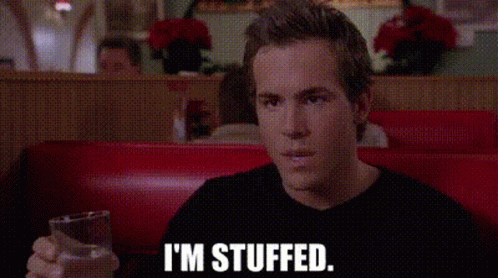 Man Sitting In Diner Holding Glass Of Water GIF
