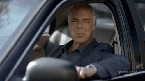 Man Sitting in Driver's Seat