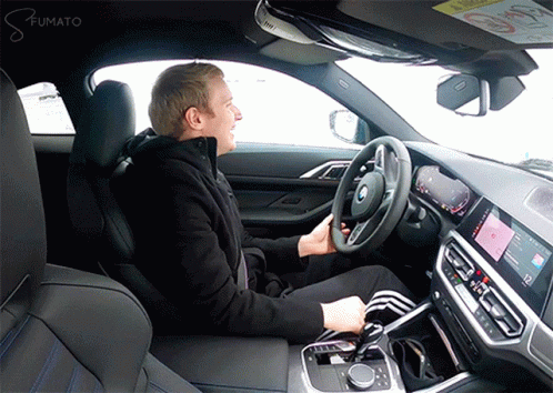 Man Sitting in Drivers Seat With Fumato