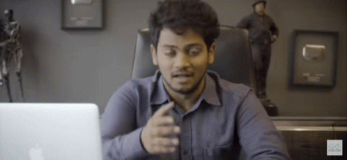 Man Sitting in Front of Apple Laptop