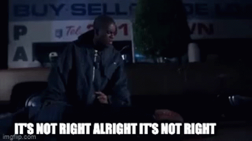 Man Sitting in Front of Buy Sell Sign