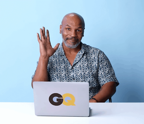 Man Sitting In Front Of GQ Laptop GIF
