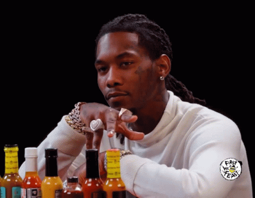 Man Sitting in Front of Hot Sauce First We Tears