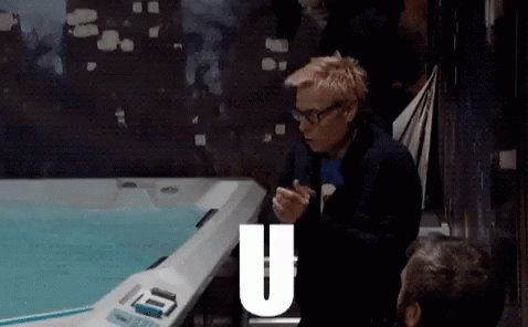 Man Sitting in Front of Hot Tub With Letter U