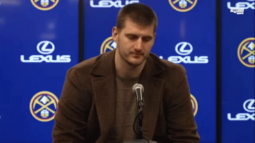 Man Sitting In Front Of Lexus Sign GIF