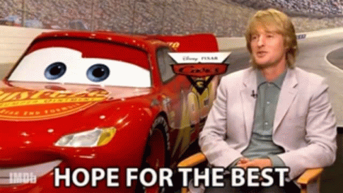 Man Sitting in Front of Lightning McQueen Car Hope for the Best