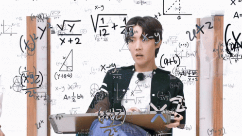 Man Sitting in Front of Math Equations